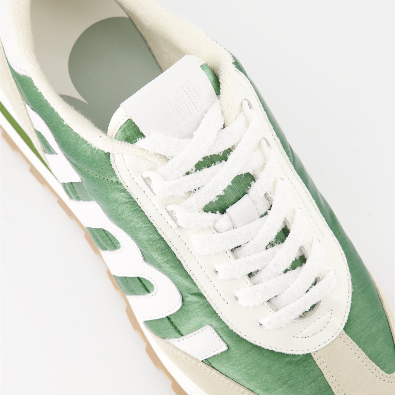 AMI Rush sneakers, green nylon sneakers, beige leather sneakers, luxury men's footwear, designer sneakers