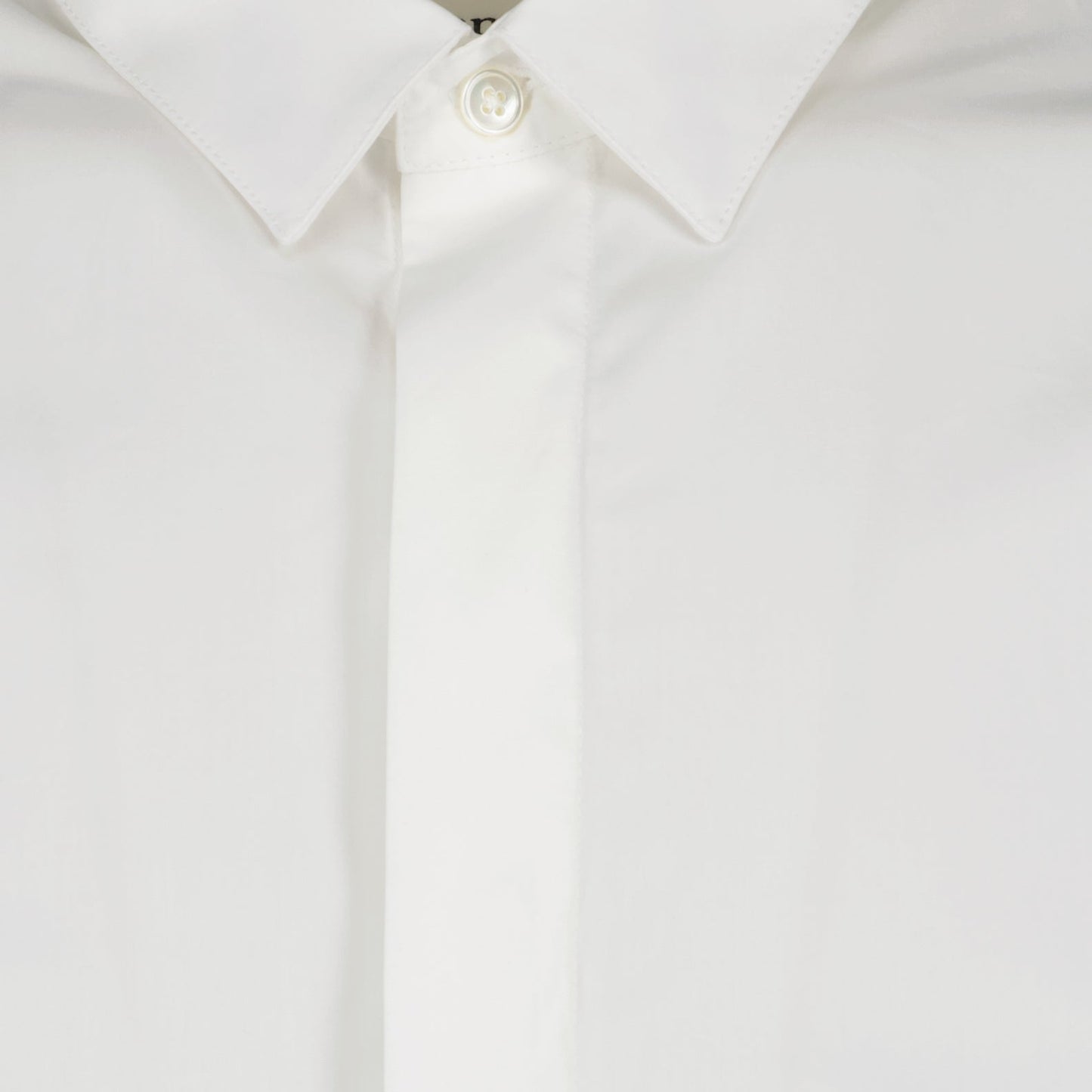 Classic white shirt, AMI Paris shirt, elegant white shirt, luxury wardrobe staple, timeless fashion piece