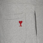 luxury jogging trousers, AMI Paris joggers, grey cotton trousers, unisex jogging pants, high-end casual wear