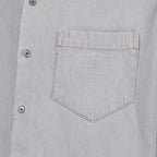 1. Distressed grey denim shirt2. AMI Paris3. Luxury casual wear4. High-quality denim5. Timeless fashion