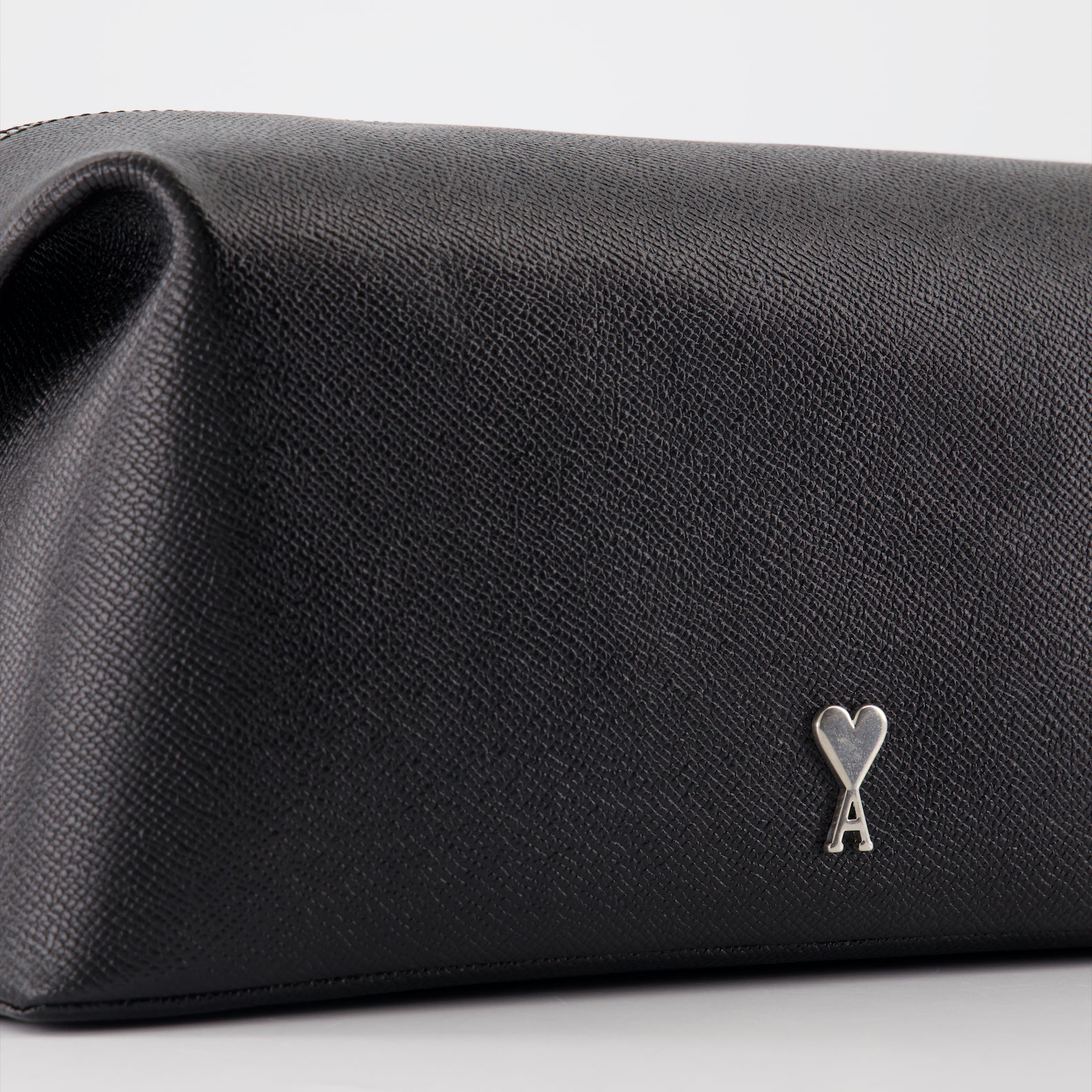 black leather pochette, Ami de Coeur, AMI Paris, luxury accessory, unisex pochette