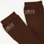 Image of Numeric Brown Socks by Mm6 for Women - Season Autumn-Winter 2025 - Front Right Three-Quarter View