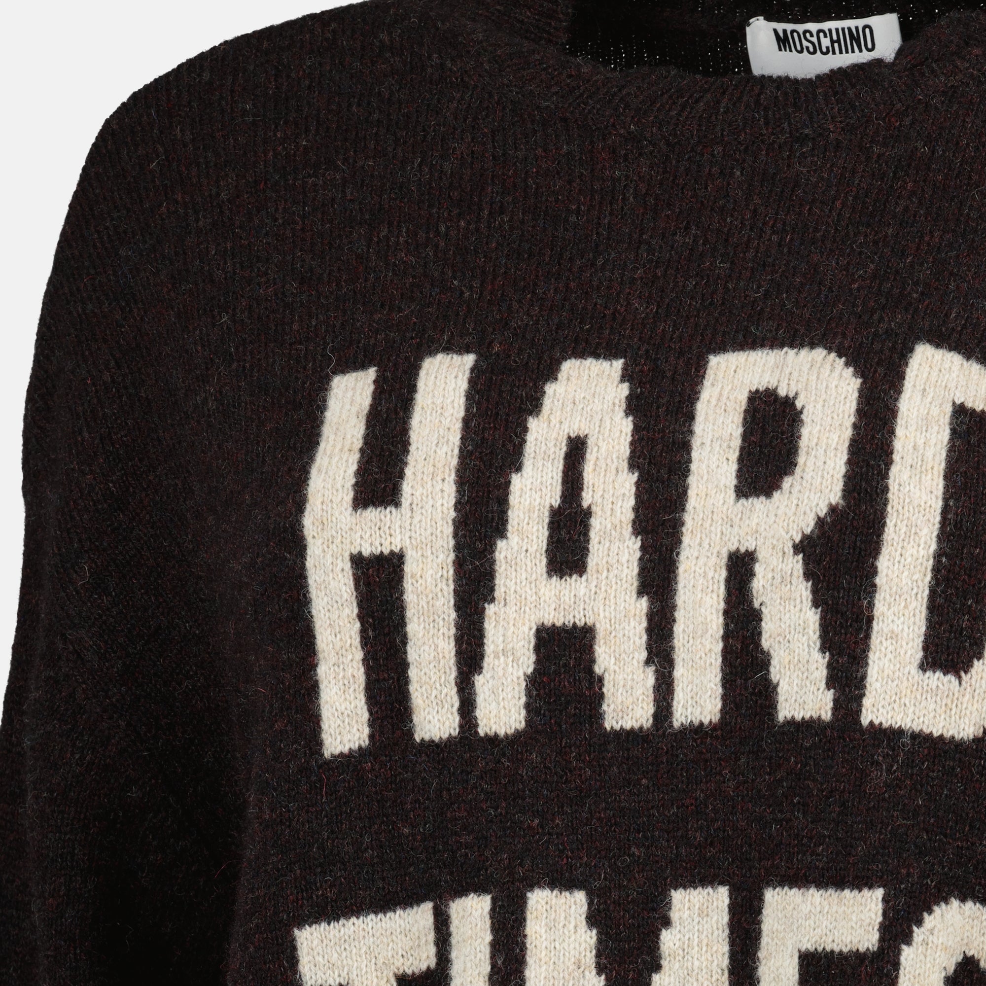 brown wool sweater, Moschino fashion, Fall-Winter 2025 collection, distressed effect clothing, luxury knitwear