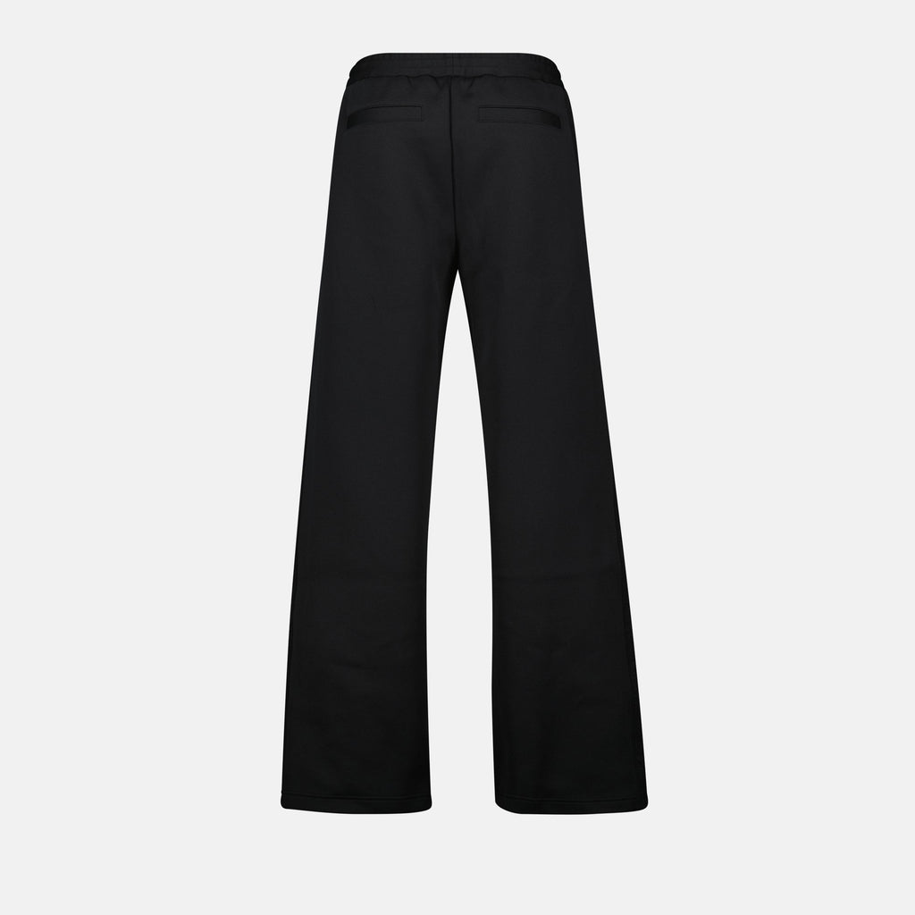 Oblique jogger pants, drawstring waist, embroidered logo, side motif, piped pockets