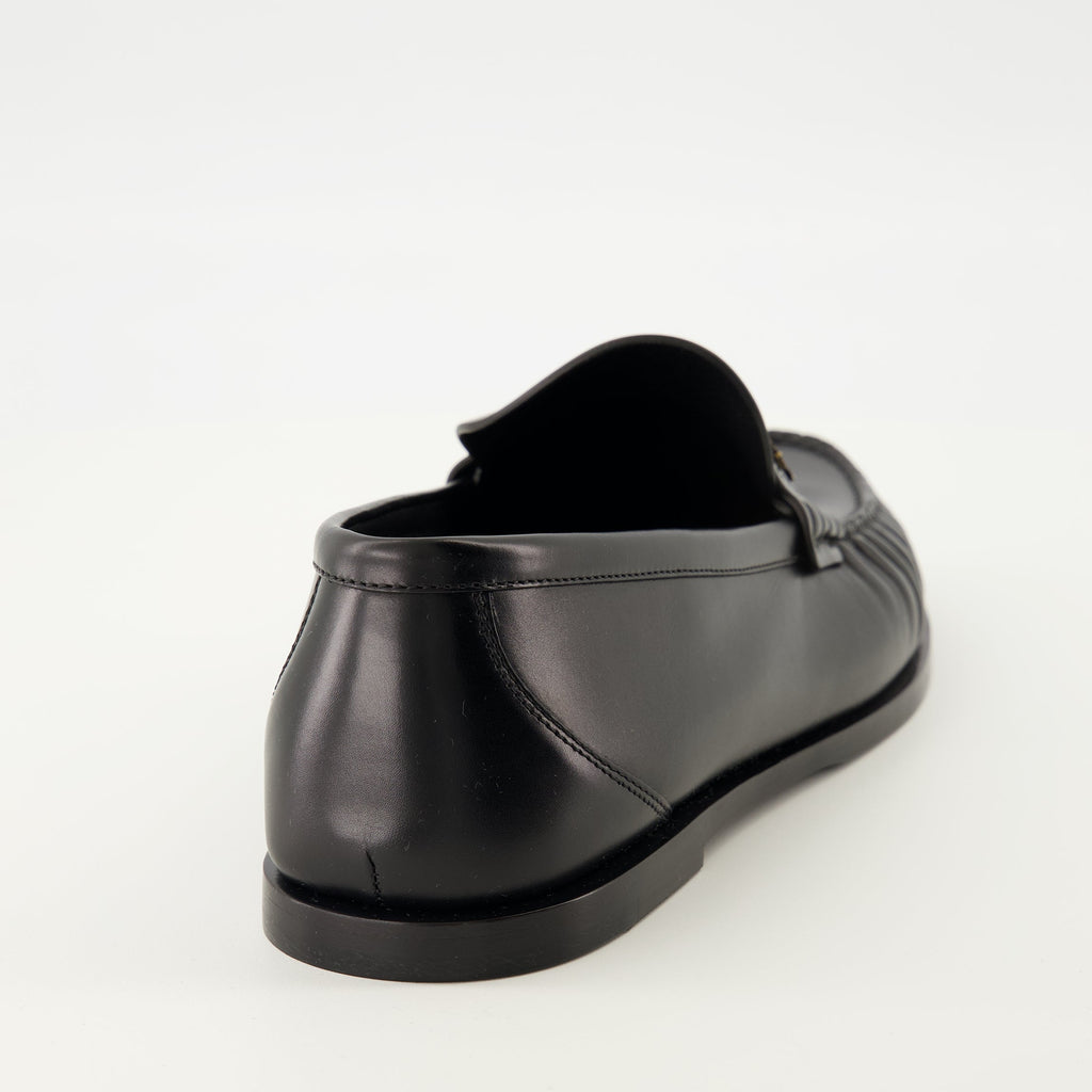 Saint Laurent loafers, black leather shoes, luxury footwear, rounded toe loafers, men's slip-on shoes