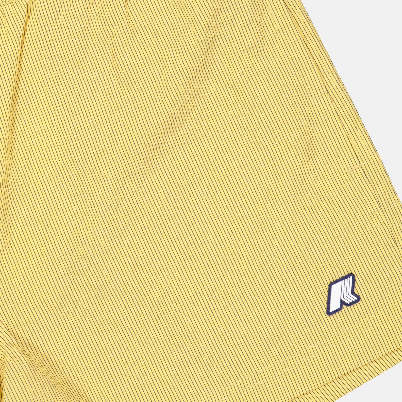 Luxury swimwear, K-Way shorts, yellow swim shorts, beach fashion, high-end swim trunks