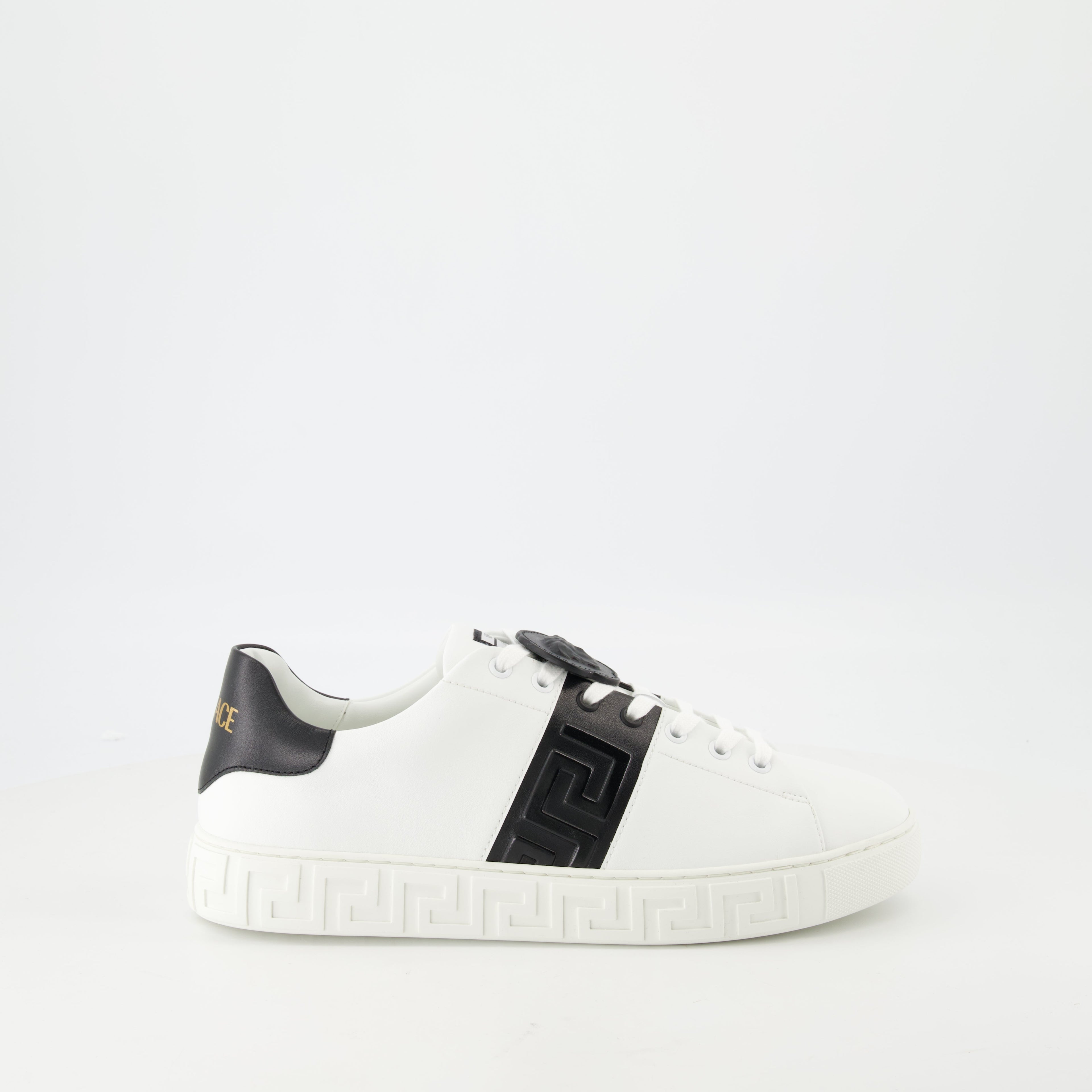 Versace sneakers, Greca design, black and white sneakers, smooth leather footwear, luxury casual shoes