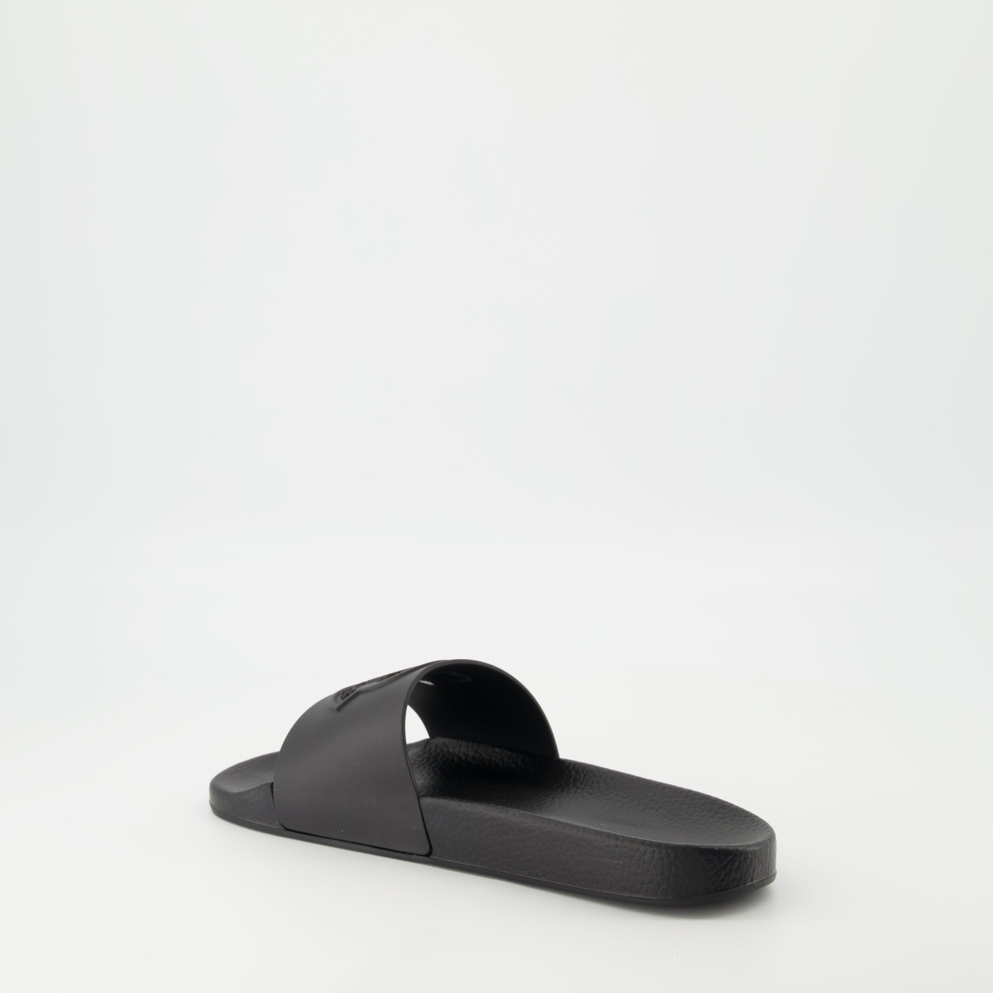 Image of Black Slides by Moncler for Men - Season Spring-Summer 2026 - Back Right Three-Quarter View