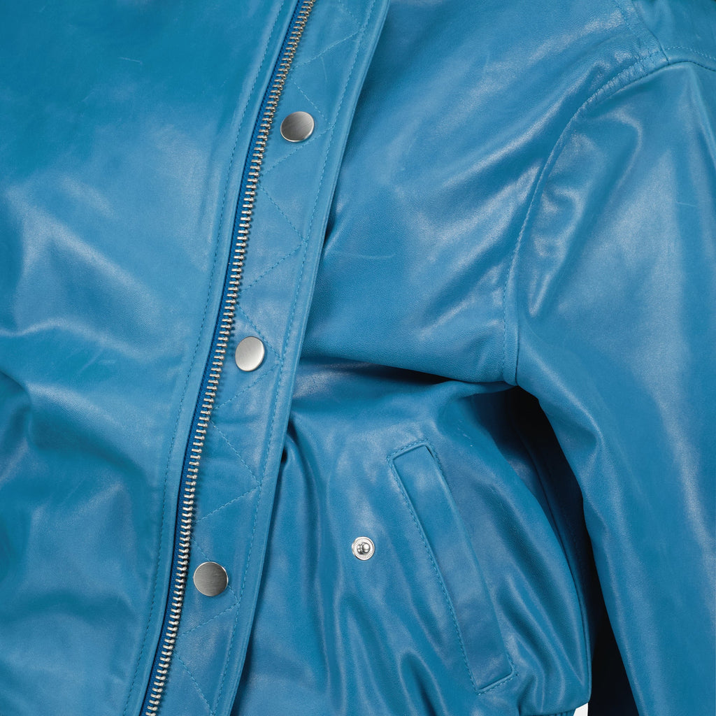 blue leather bomber jacket, Christopher Esber jacket, Autumn-Winter 2025 fashion, women's bomber jacket, luxury outerwear