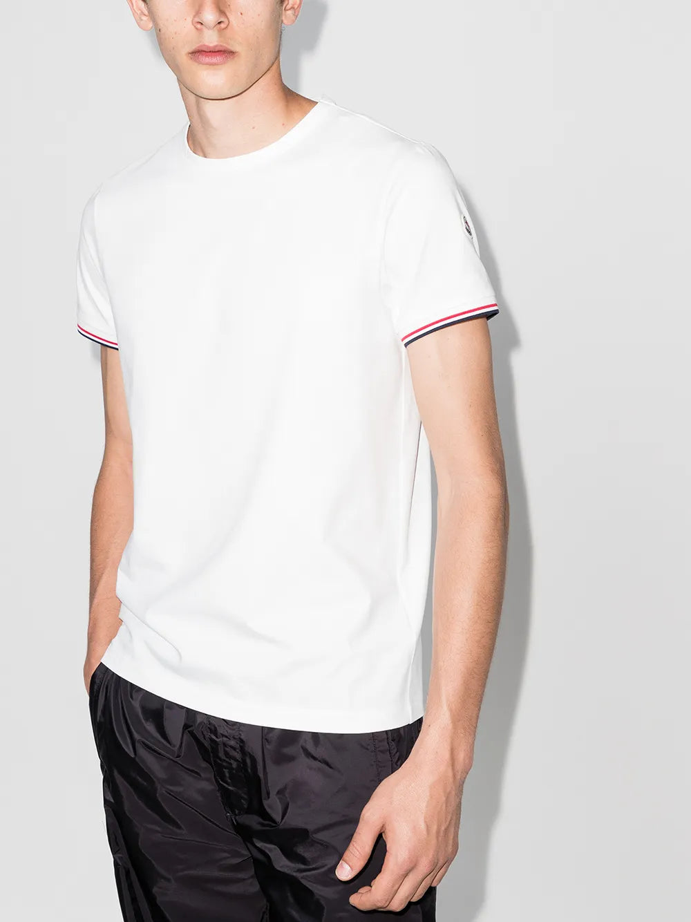 Moncler T-shirt, White logo T-shirt, Luxury trim T-shirt, High-end fashion T-shirt, Designer casual wear