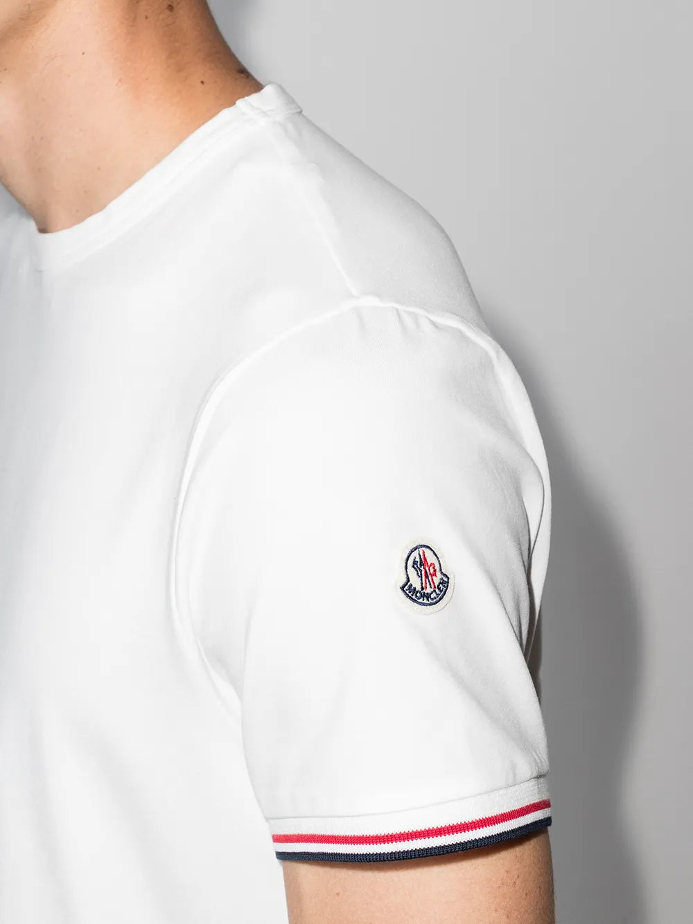 Moncler T-shirt, White logo T-shirt, Luxury trim T-shirt, High-end fashion T-shirt, Designer casual wear