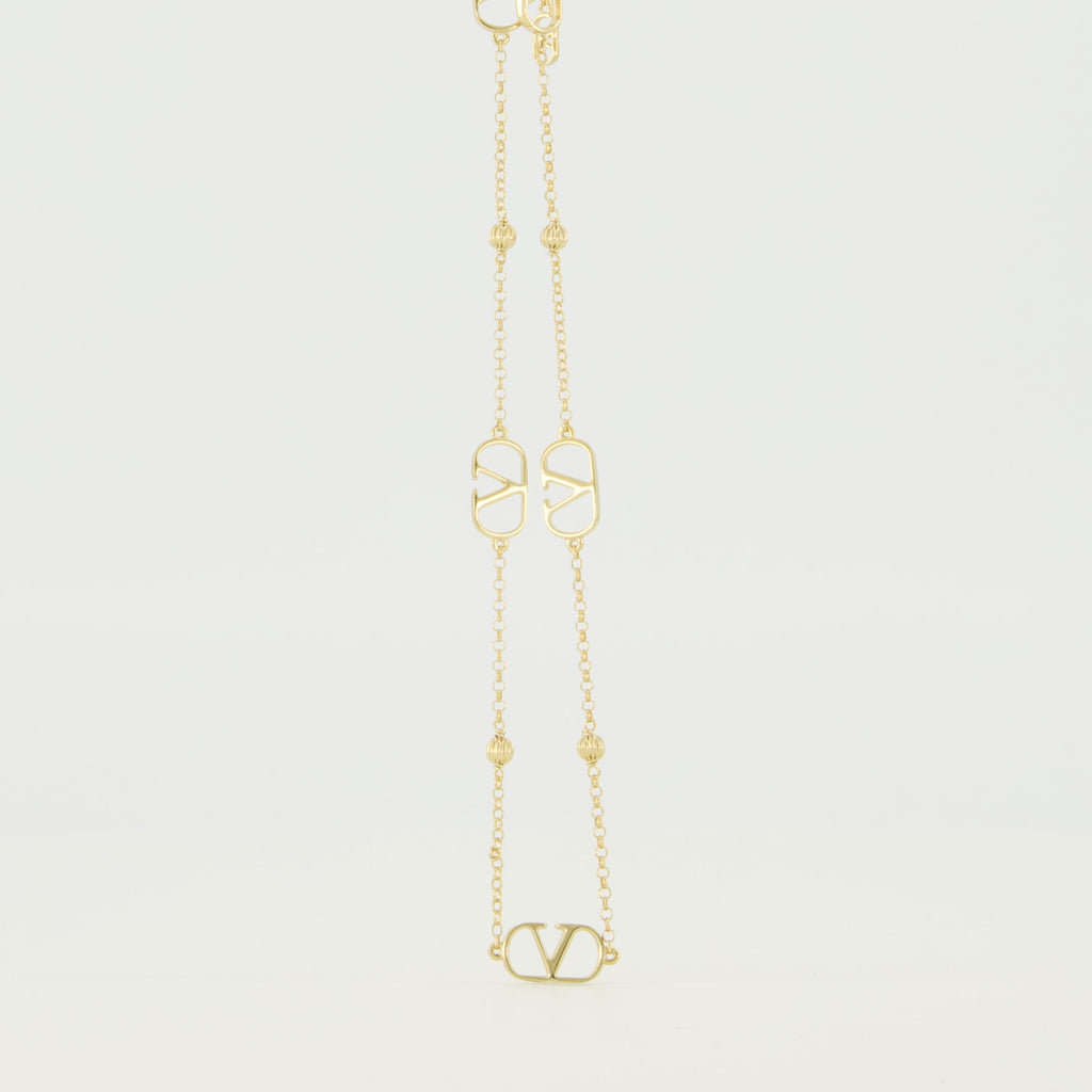 バレンティノ・ガラヴァーニの女性用Vlogoゴールドネックレスの画像 - 2026年春夏シーズン - 後面ビュー