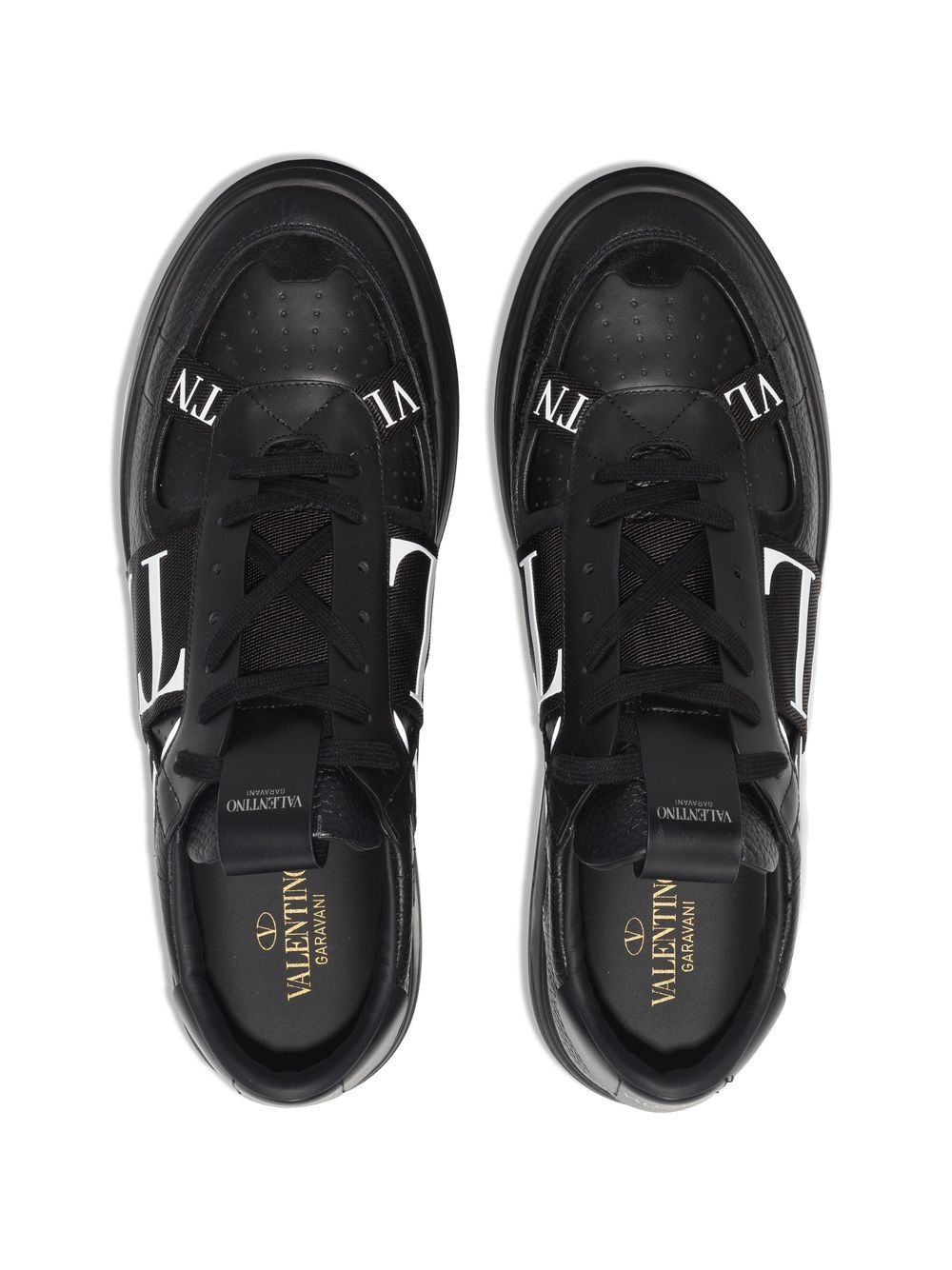 Valentino Garavani sneakers, black leather sneakers, luxury men's footwear, Autumn-Winter 2024 collection, premium grained leather