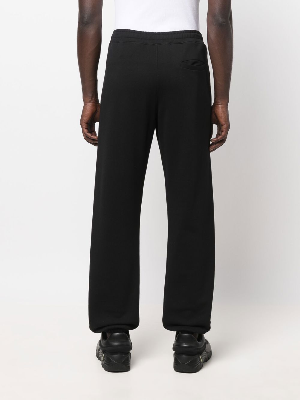 Moschino trousers, logo pants, luxury menswear, designer clothing, masculine trend