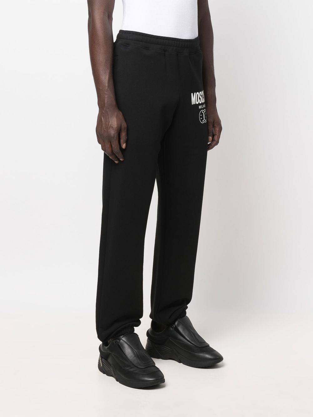 Moschino trousers, logo pants, luxury menswear, designer clothing, masculine trend