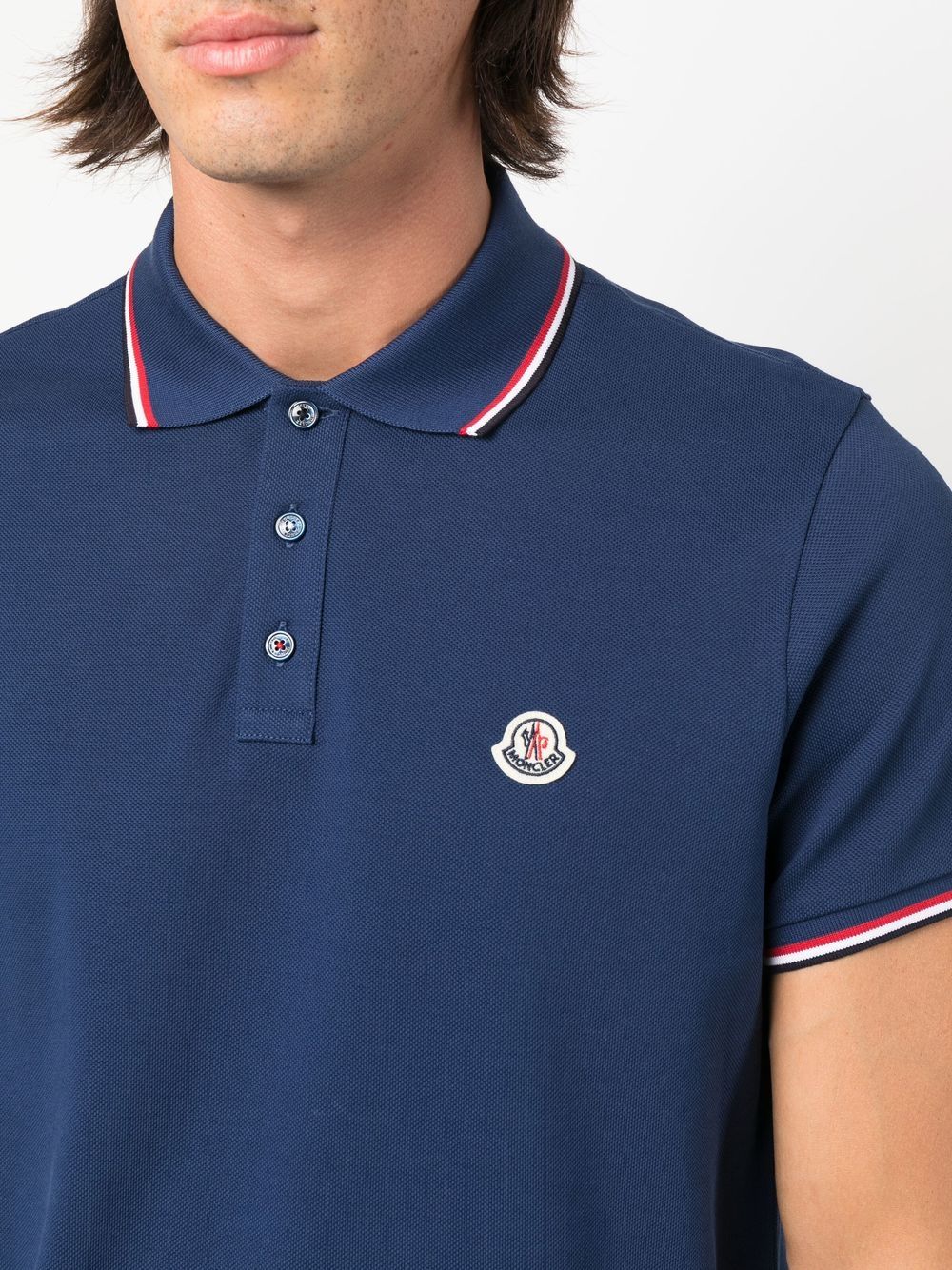 - Men's Moncler Polo
- Deluxe Navy Blue
- Piqué Cotton
- Trendy Logo
- Tailored Fit