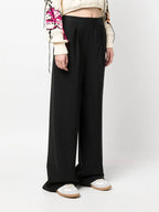 black wool pants, MSGM, luxury women’s pants, straight-leg trousers, high-end fashion
