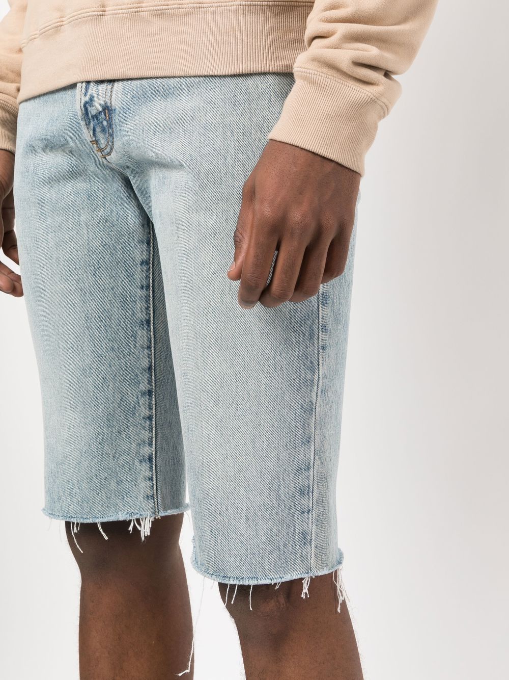 Saint Laurent Bermuda shorts, distressed denim shorts, luxury men's shorts, designer denim shorts, high-end casual wear