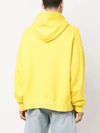 Image of Yellow Broken Palm Hoodie by Palm Angels for Men - Season Spring-Summer 2023 - Model view 3