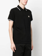 Image of Black Polo Shirt with Contrasting Trims by Moncler for Men - Season Spring-Summer 2024 - Detail View 1