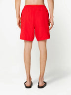 Image de shorts de bain rouges longs par Ami PARIS pour hommes - Saison Printemps-Été 2023 - Vue du modèle 3