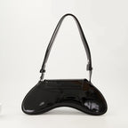 asymmetrical shoulder bag, black glossy bag, designer shoulder bag, adjustable strap bag, Diesel shoulder bag