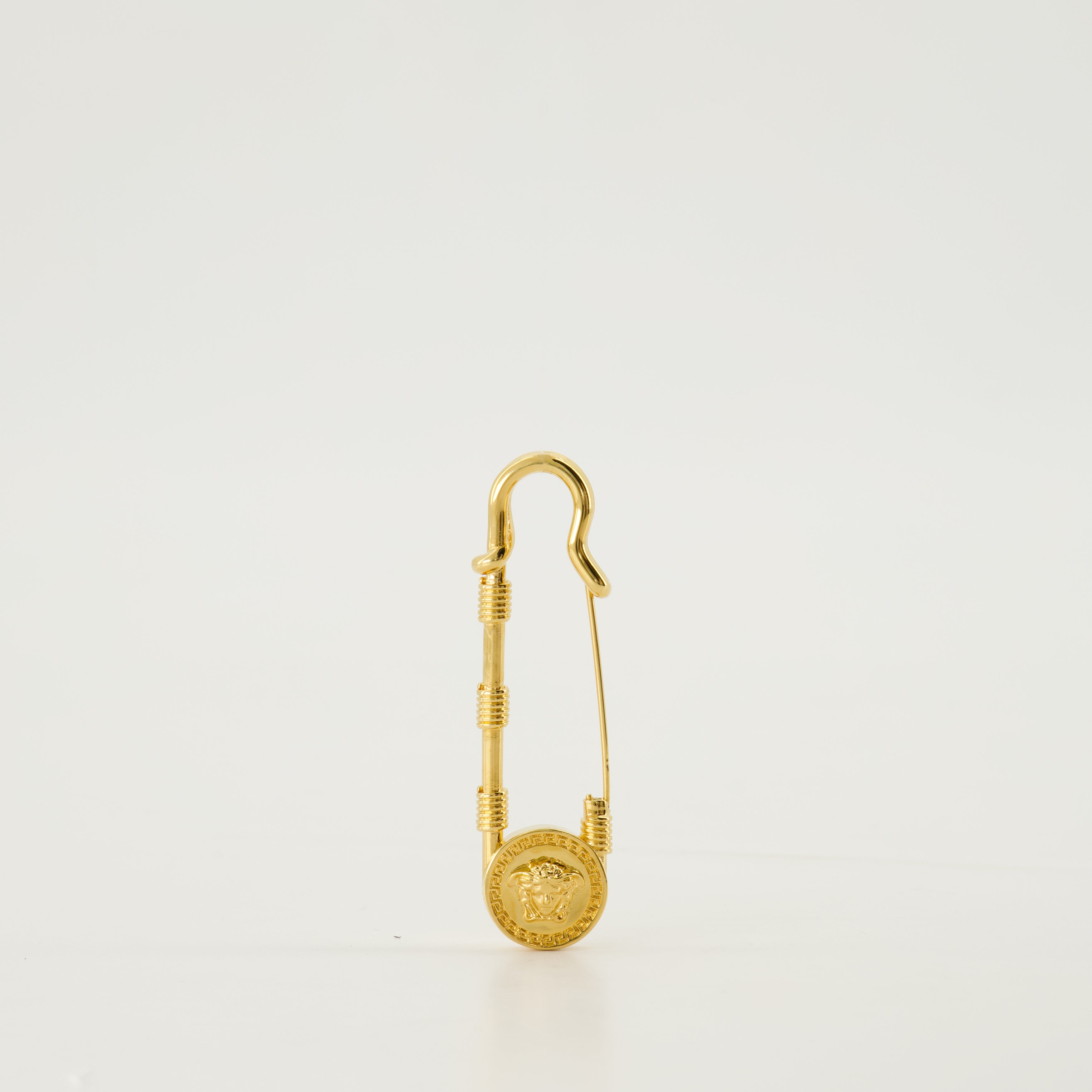 Medusa brooch, gold safety pin, Versace accessory, engraved logo brooch, vintage brass pin
