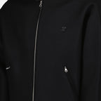 Bild einer Woll-Bomberjacke von Courrèges für Unisex - Saison Herbst-Winter 2024 - Detailansicht 1