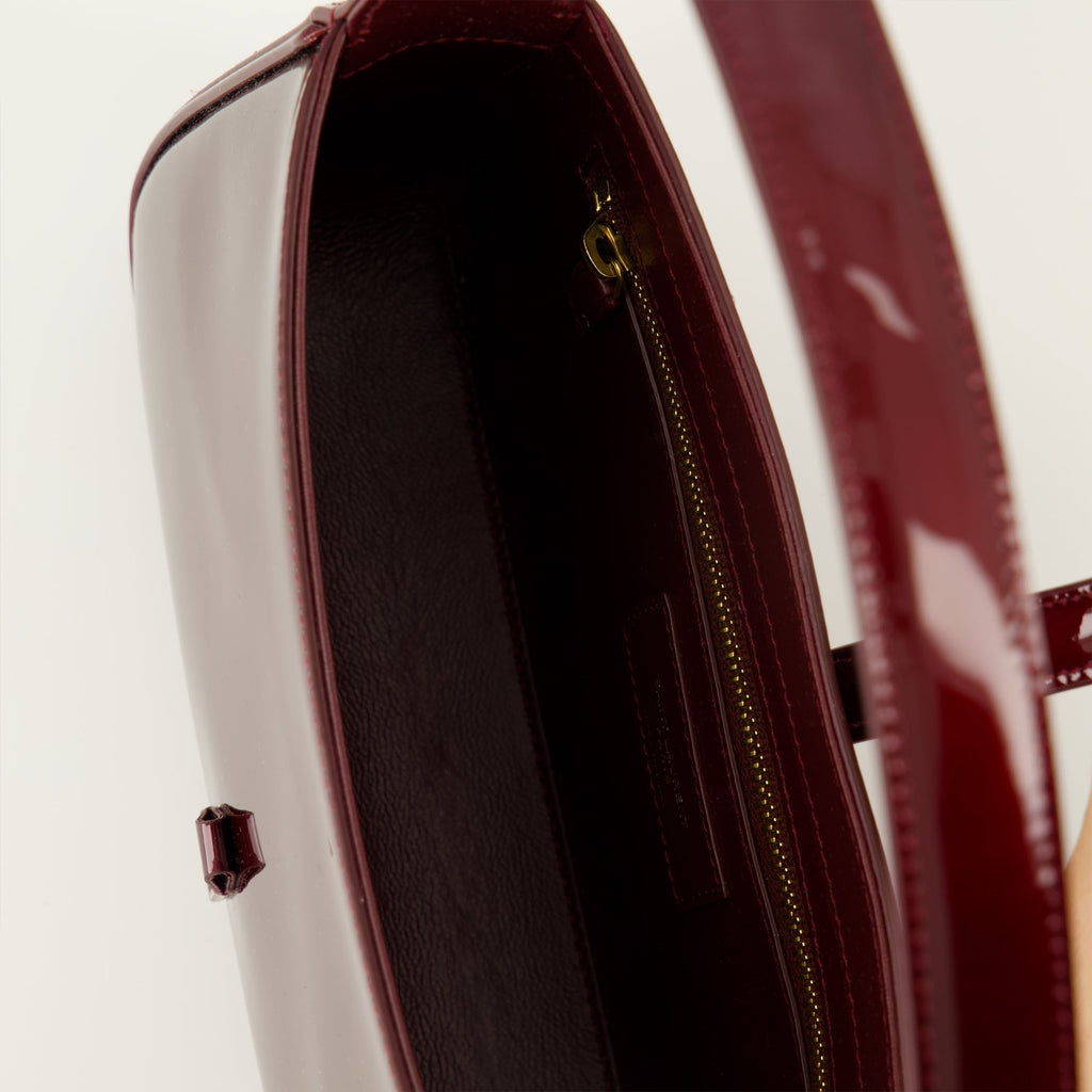 Saint Laurent bag, bordeaux leather bag, patent leather accessories, luxury handbags, designer carryall