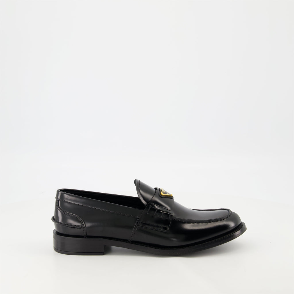 black leather moccasins, Prada footwear, brushed leather shoes, designer slip-ons, stylish moccasins