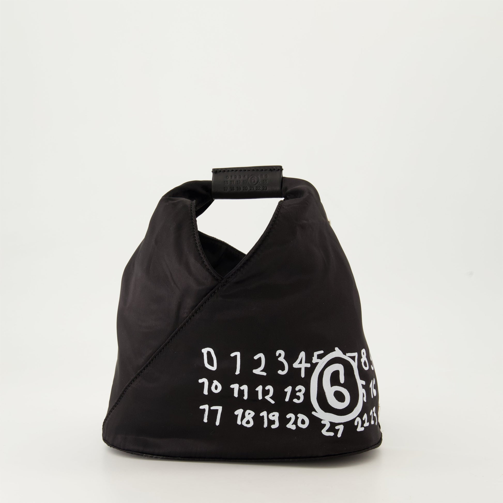 black nylon bag, leather strap bag, MM6 bag, hand-written numeric logo, luxury bag collection