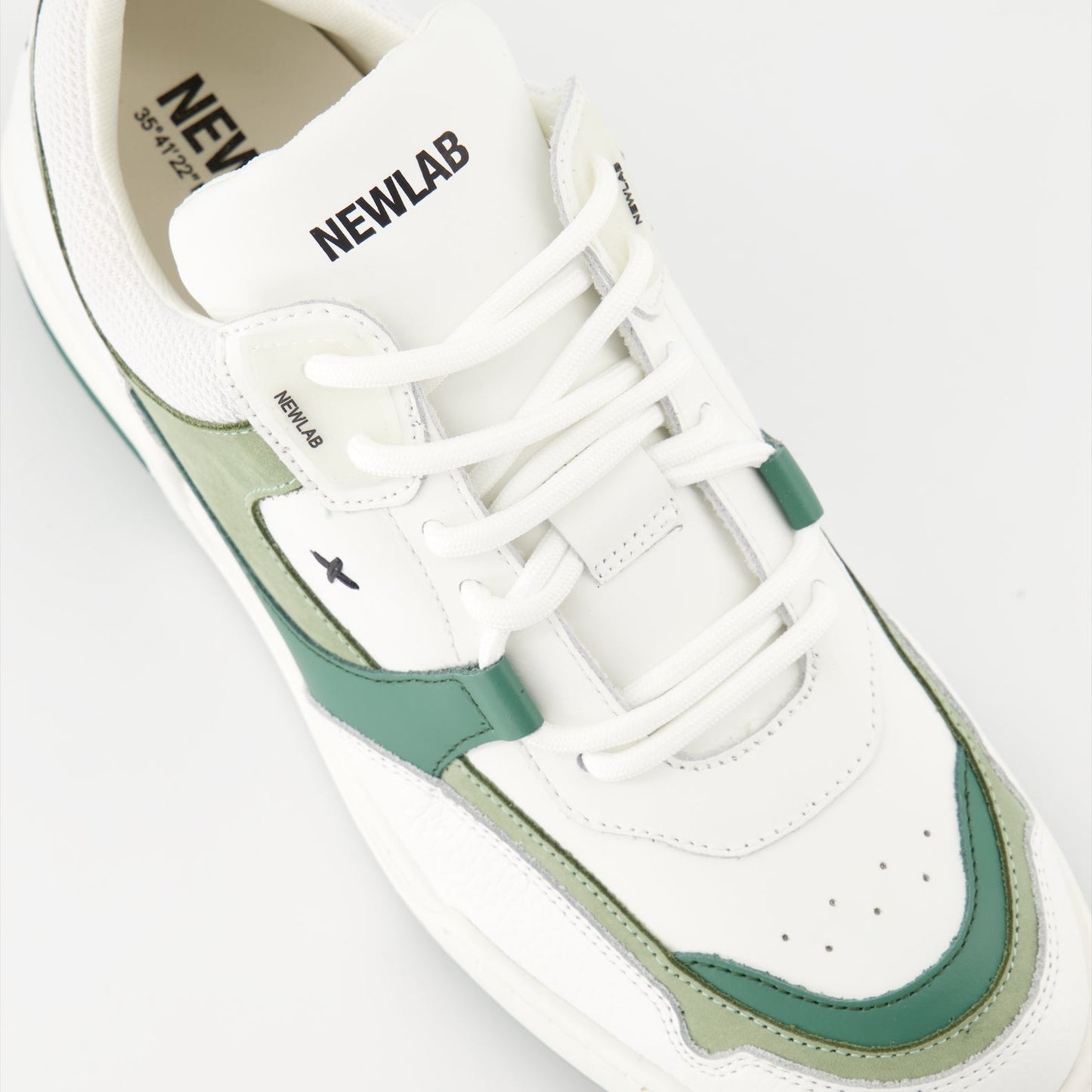 luxury sneakers, white leather shoes, green suede accents, New Lab collection, high-end fashion