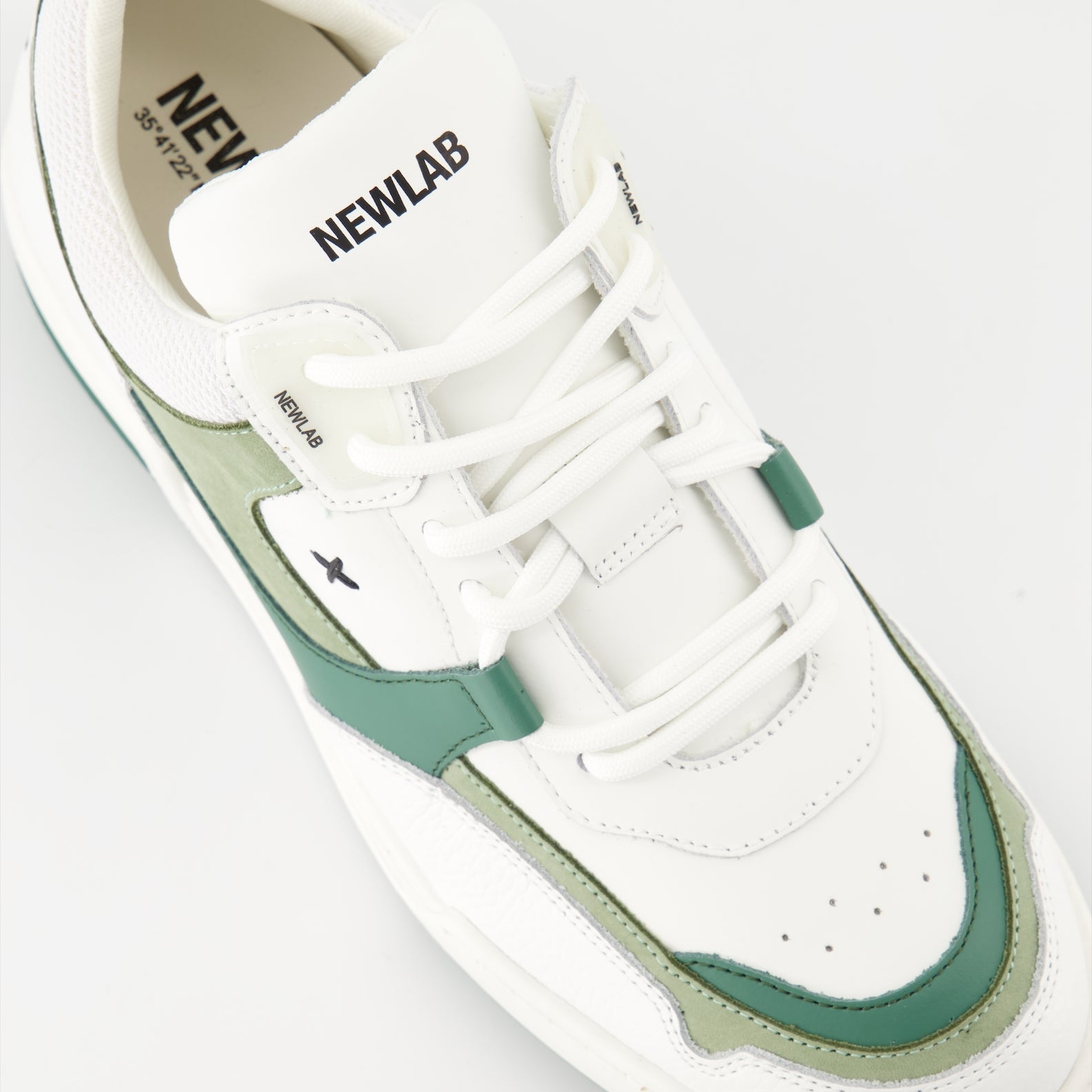 luxury sneakers, white leather shoes, green suede accents, New Lab collection, high-end fashion