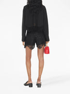 Image of Black Lace Macramé Shorts by Burberry for Women - Season Spring-Summer 2023 - Model view 3
