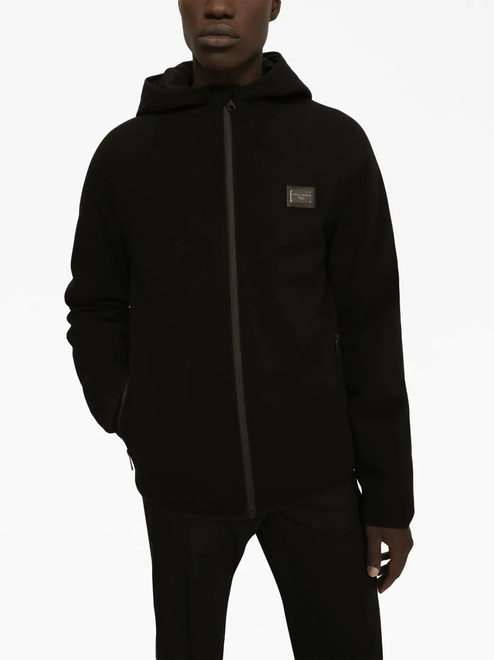 black windbreaker, metal logo plaque, nylon jacket, adjustable hood, zip closure