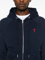 ネイビーのジップアップスウェットシャツ