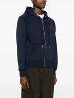 ネイビーのジップアップスウェットシャツ