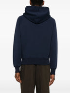 ネイビーのジップアップスウェットシャツ