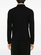 Image d'un polo noir classique avec poche par Saint Laurent pour hommes - Saison Automne-Hiver 2023 - Vue du modèle 7