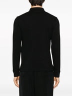 Image d'un polo noir classique avec poche par Saint Laurent pour hommes - Saison Automne-Hiver 2023 - Vue du modèle 5
