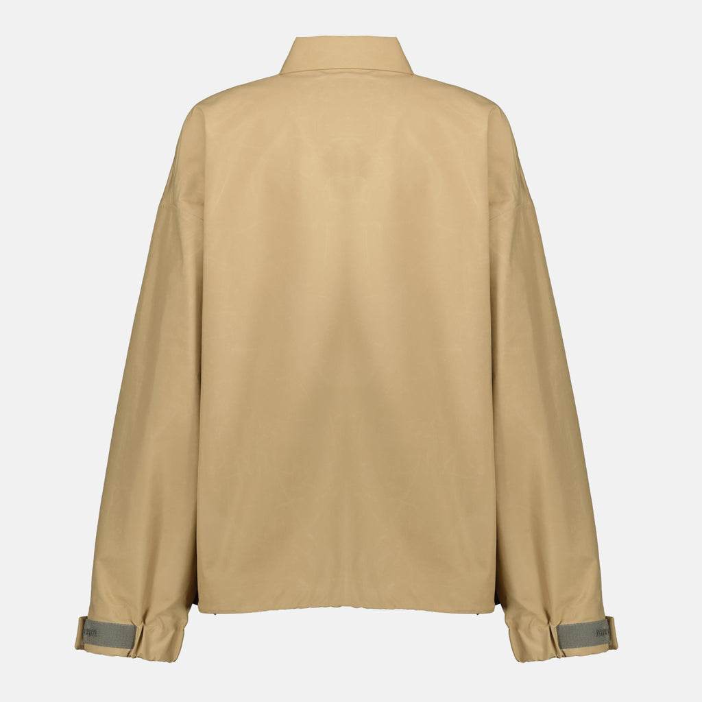 beige windbreaker, Miu Miu outerwear, spring-summer 2026 collection, technical polyester jacket, stylish windbreaker