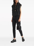 Image of Sleeveless Re-nylon Vest Black by Prada for Women - Season Spring-Summer 2025 - Model view 1