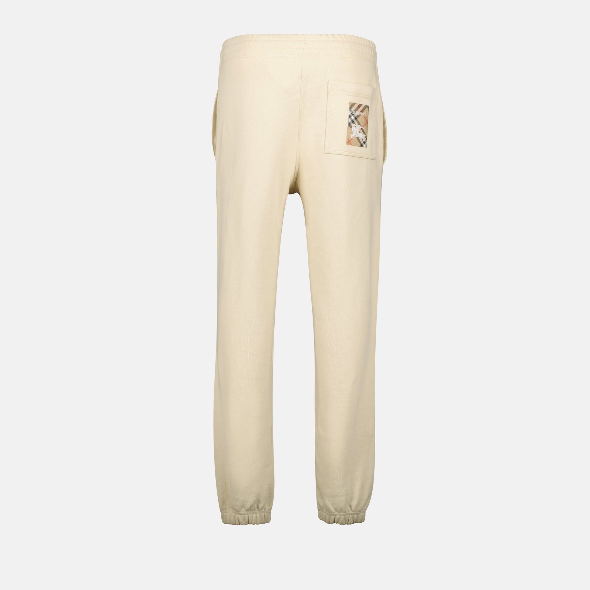 beige jogging pants, logo embroidery, wide fit pants, cotton joggers, Burberry Spring-Summer 2025