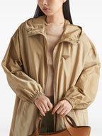 Prada parka, Re-Nylon jacket, luxury outerwear, sustainable fashion, high-end beige coat