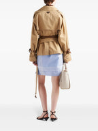 Image of Short Beige Cotton Serge Trench Coat by Prada for Women - Season Autumn-Winter 2024 - Detail View 1