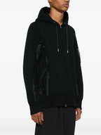 Image of Black Zip Sweatshirt by Sacai for Men - Season Autumn-Winter 2025 - Detail View 1
