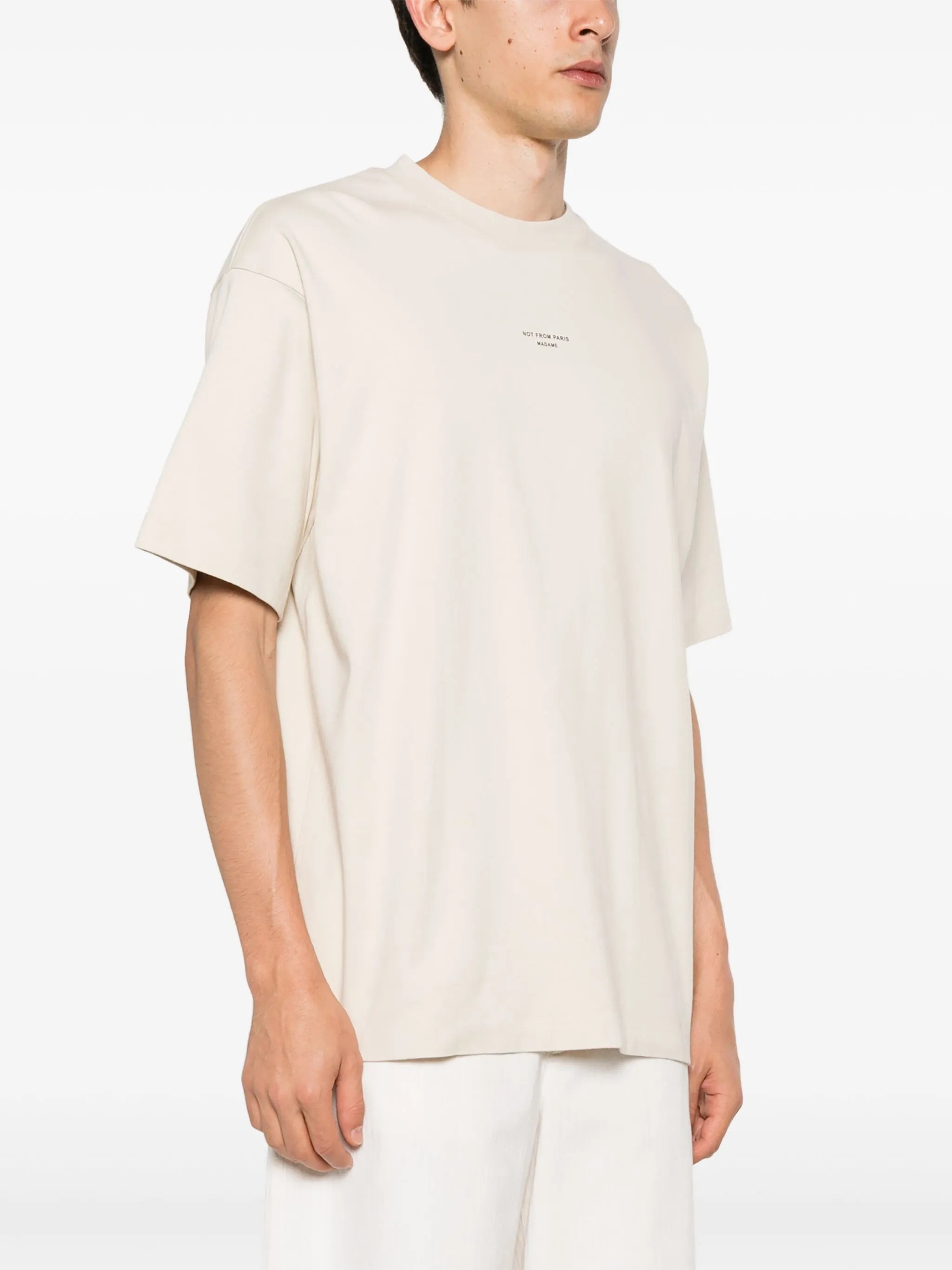 Image of Classic Beige Slogan T-Shirt by Drole De Monsieur for Men - Season Spring-Summer 2026 - Model view 2