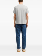 Image of Grey T-shirt with Red Heart Logo by Ami PARIS for Unisex - Season Spring-Summer 2025 - Model view 3