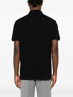 Image of Black Piqué Cotton Polo by Moncler for Men - Season Autumn-Winter 2025 - Model view 3