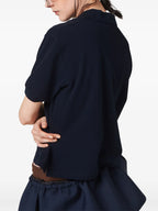 Image of Piqué Cotton Polo Shirt by Miu Miu for Women - Season Spring-Summer 2026 - Model view 4